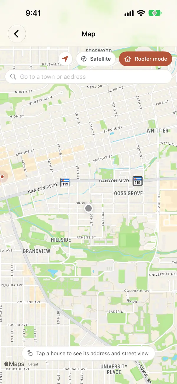The map on an iPhone with Roofer mode on, a location button, a search box reading Go to a town or address, and the hint: Tap a house to see its address and street view.